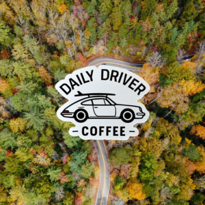 Daily Driver Coffee Logo Sticker with Porsche-inspired silhouette and surfboard